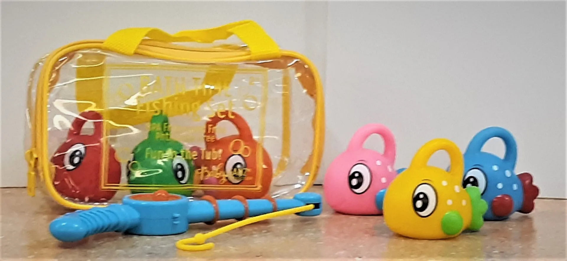A plastic bag with a fishing rod and toys in it