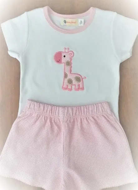 A white shirt with a pink giraffe embroidered on it