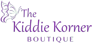 A black and white logo for the kiddie korner boutique.